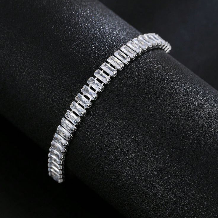 Silver bracelet on a black surface