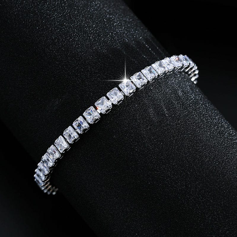 Diamond bracelet on a black cushion with a dark background