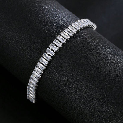 Silver bracelet on a black surface
