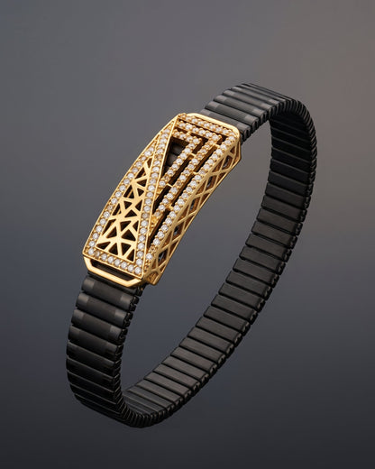 Black bracelet with a gold clasp on a dark background