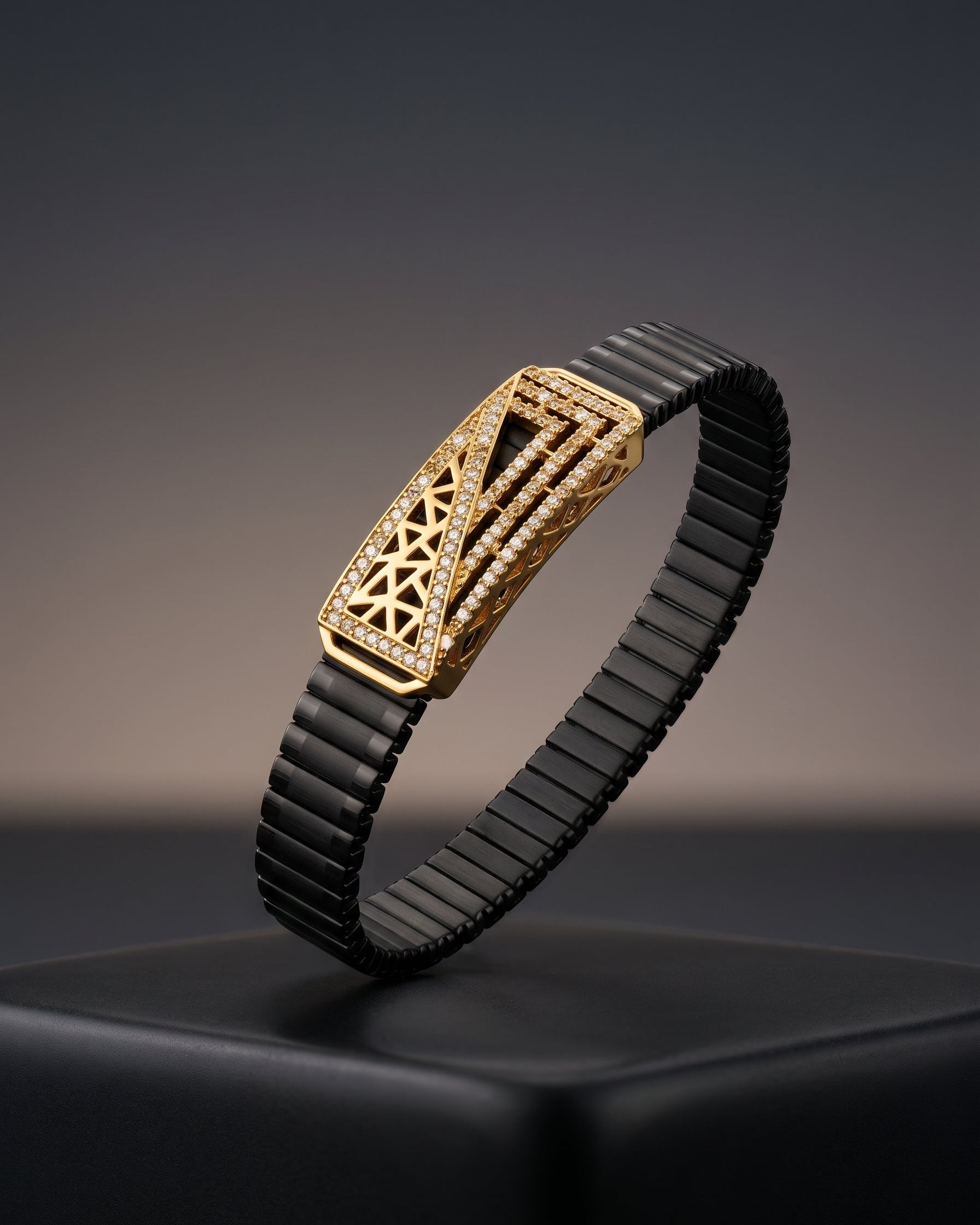 Gold and black bracelet on a dark background