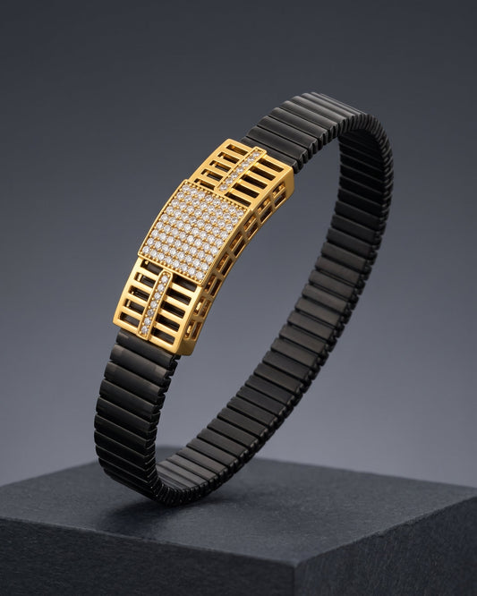 Black and gold bracelet on a dark gray background