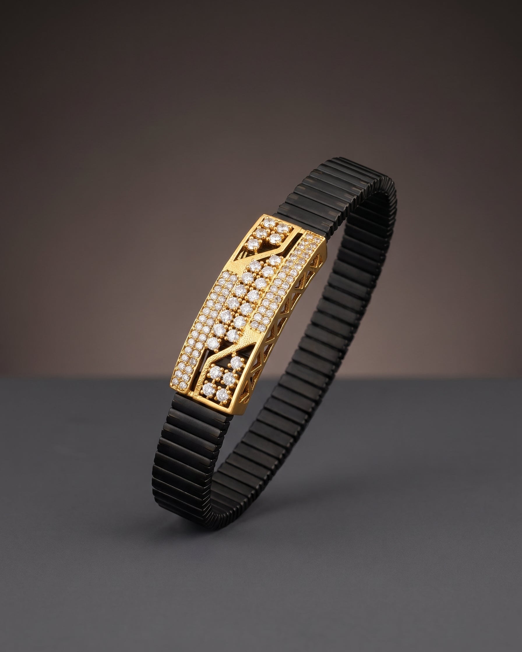 Black and gold bracelet on a dark background