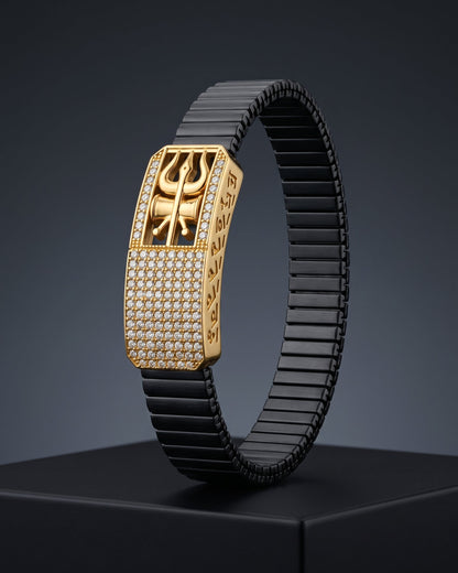 Luxury bracelet with gold clasp and black band on a dark background