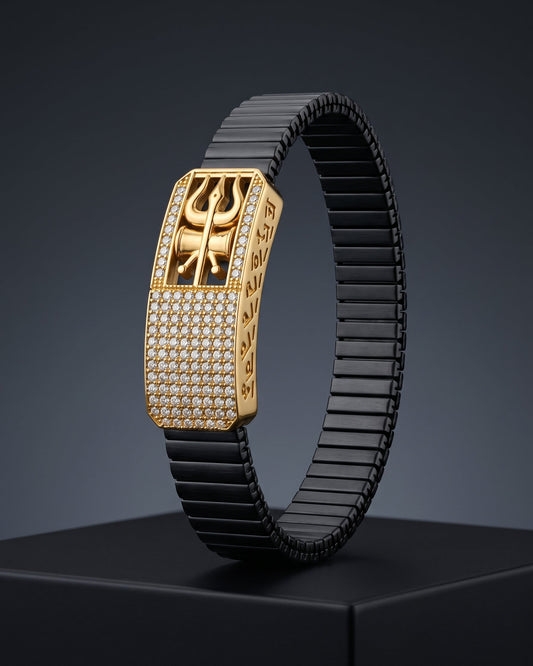 Luxury bracelet with gold clasp and black band on a dark background